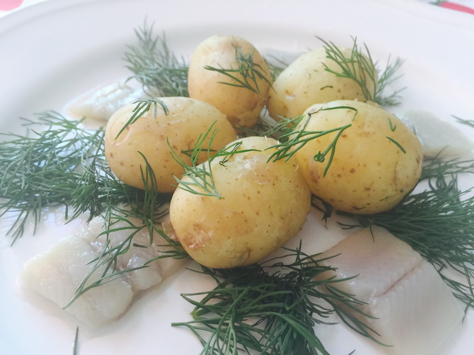 Midsummer Eve the Nordic way new potatoes, dill and pickled herring