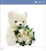 Teddy Bear Holding Flower