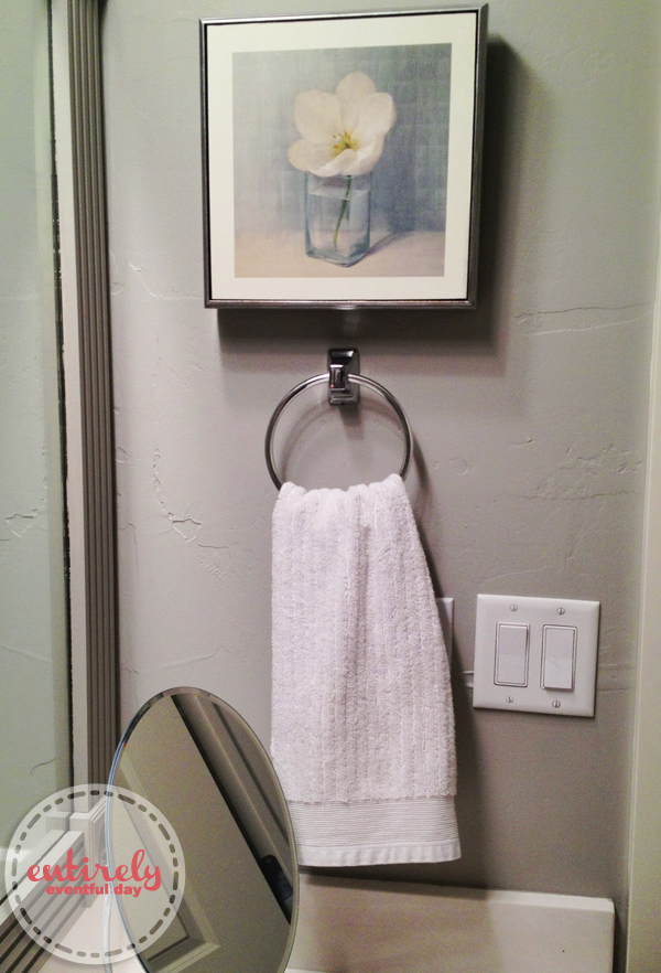 Beautiful DIY bathroom makeover.  I love the gray. She painted a silver stripe at the top of the wall and it looks amazing.  I wouldn't have thought of that.  Must pin! entirelyeventfulday.com #DIY #bathroom