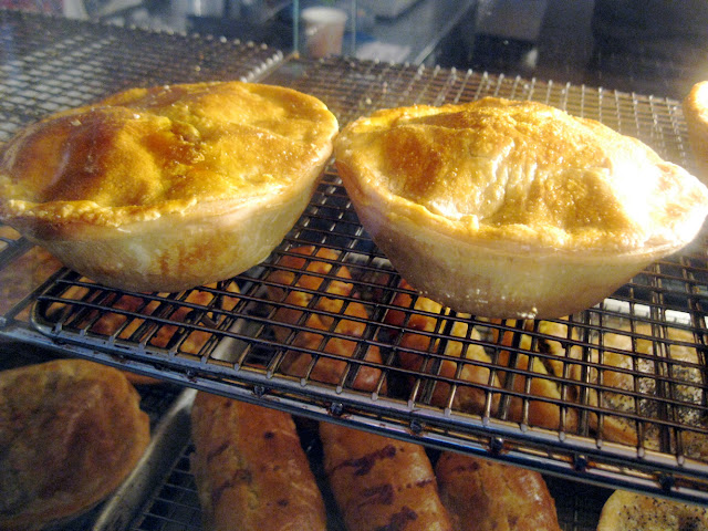 Near perfect pies adorn the racks at Tuck Shop