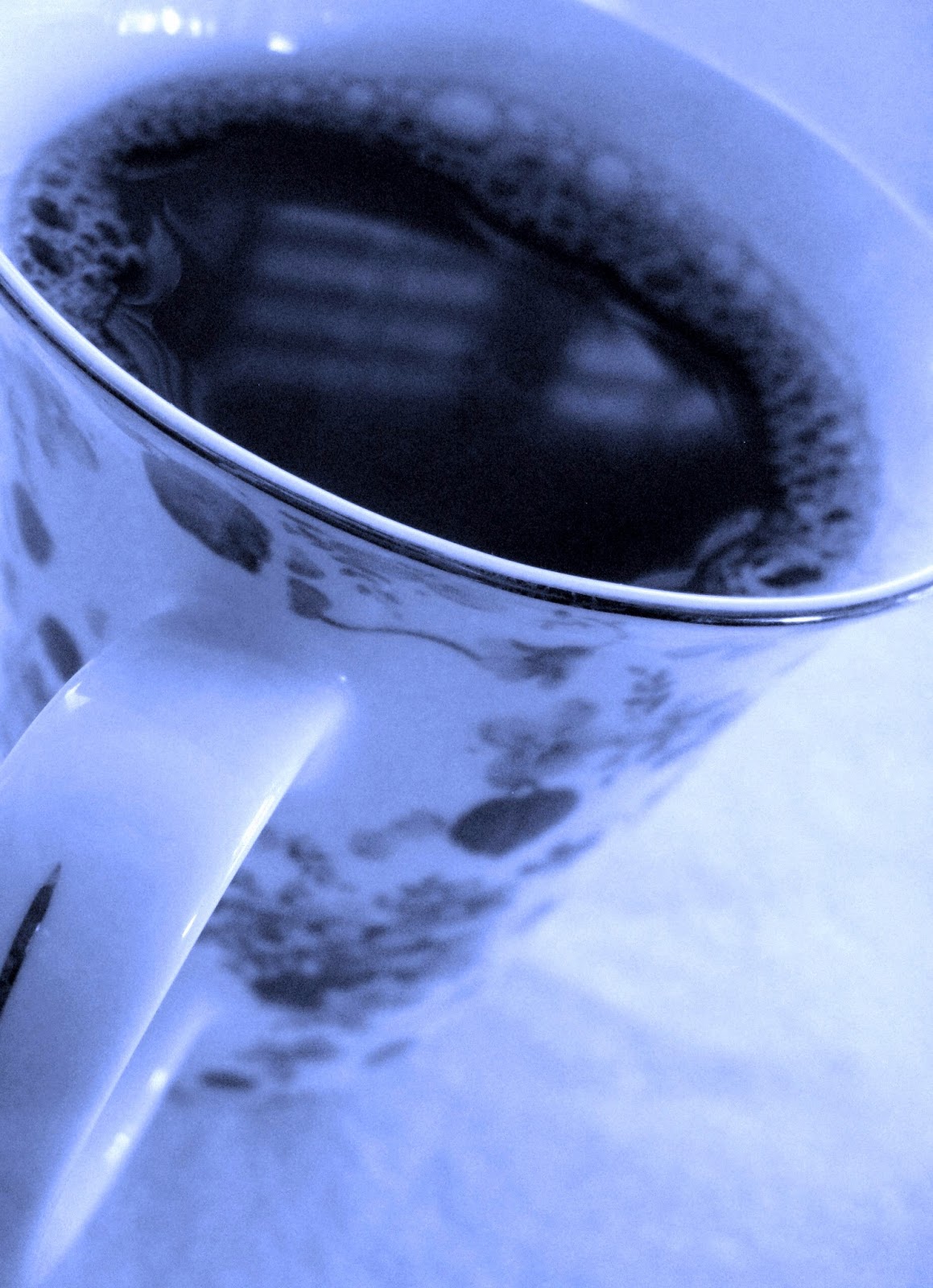 cup_of_black_coffee_in_floral_china_cup