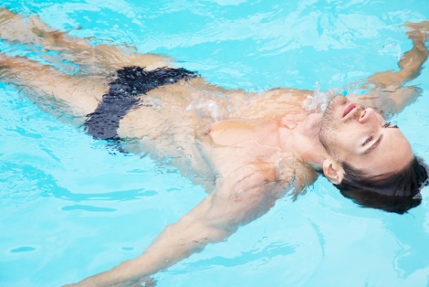 Nick Steele floating in swimming pool by Greg Lotus
