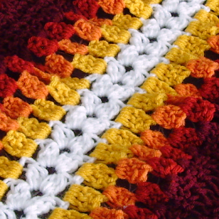 Close-up of Super Mario Bros. fire flower mile-a-minute crochet afghan