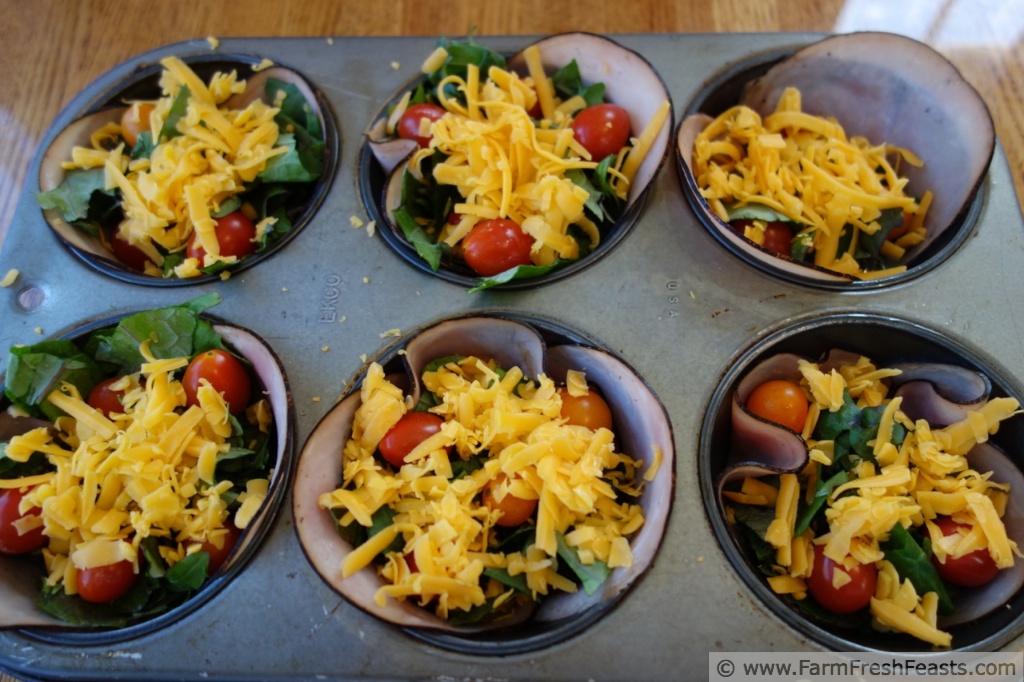 Farm Fresh Feasts Red Russian Kale, Tomato, and Eggs Baked in Ham Cups