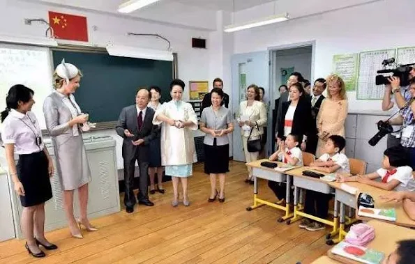 Queen Mathilde of Belgium and Chinese first lady Peng Liyuan visit the Qiyin Experimental Primary School in Beijing, China