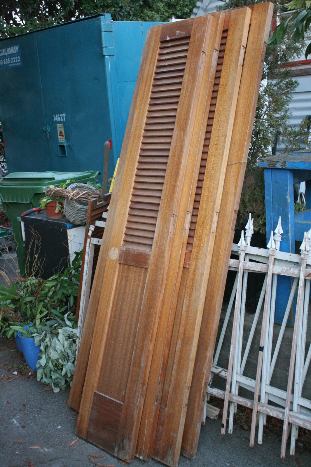 Reloved Rubbish Wall Sconces on Old Shutter Doors