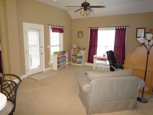 Family Room with additional door to Covered Patio and Back Yard (carpet in pic replaced)