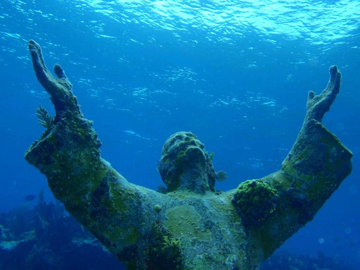 Christ of the Abyss is a submerged bronze statue of Jesus, of which the original is located in the Mediterranean Sea off San Fruttuoso between Camogli and Portofino on the Italian Riviera. It was placed in the water on 22 August 1954 at approximately 17 metres depth, and stands c. 2.5 metres tall. Various other casts of the statue are located in other places worldwide, both underwater and in churches and museums. The sculpture was created by Guido Galletti after an idea of Italian diver Duilio Marcante. The statue was placed near the spot where Dario Gonzatti, the first Italian to use SCUBA gear, died in 1947. It depicts Christ offering a blessing of peace, with his head and hands raised skyward.