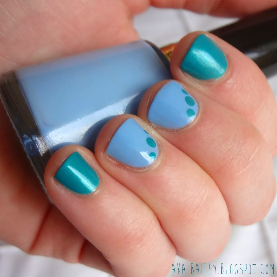 Turquoise nails with light blue accent nails, turquoise dots on blue nails