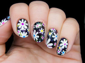 Electric daisy nail art by @chalkboardnails