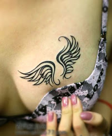 angel wings tattoo on the breast
