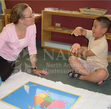 NAMC montessori teacher with student world map puzzle worries as new teacher