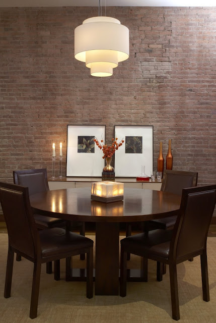 dining room with stone wall