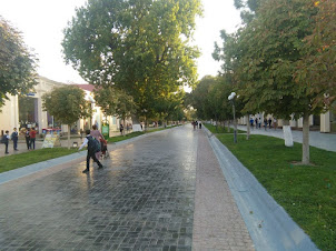 View of plush Karimov street with designer shops and restaurants on either side of the street.