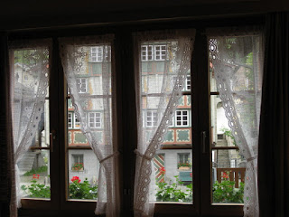 View from my hotel room, through lace curtains, Andermatt, Switzerland