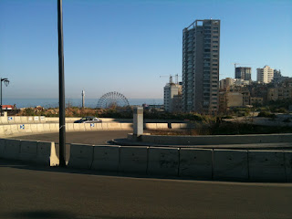 a road with a city in the background