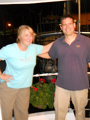 Astronomers Heather and Derek from s/v PARALLAX (with our Valentine's Day Geranium).