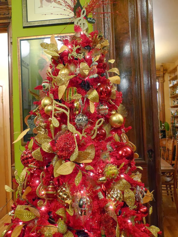 ... tree with red ornaments. This tree's unusual hue turns that around in