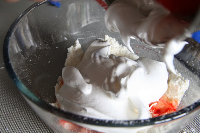 Meringue folded into almond meal-sugar mixture. 