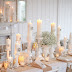 A White Thanksgiving table and embellishing candles