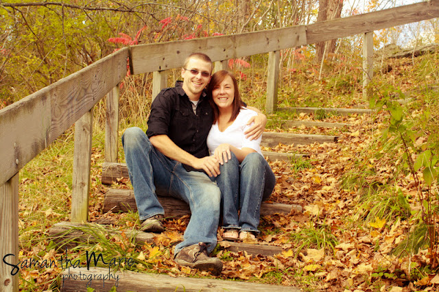 couple sitting on wooden steps in the fall