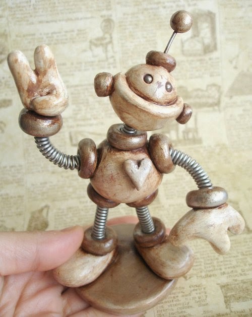 16-Sepia-Sam-HerArtSheLoves-Clay-Robot-World-Sculptures-www-designstack-co