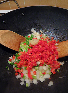 Sweet Red Peppers with Onions in Wok