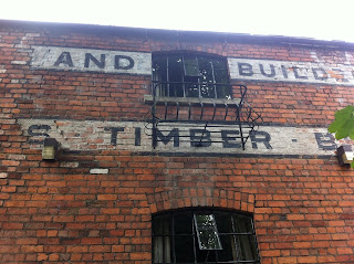 Ghost sign on old merchant's building in Nailsworth, Gloucestershire 