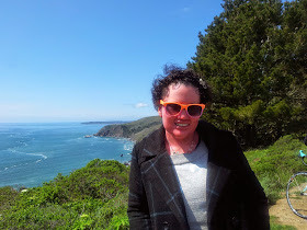 Carly Findlay in front of sea at Sausalito, USA