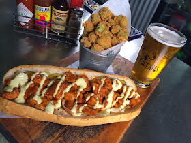 Blackened Alligator Po-Boy with Fried Okra and a pint of Tin Roof Blonde