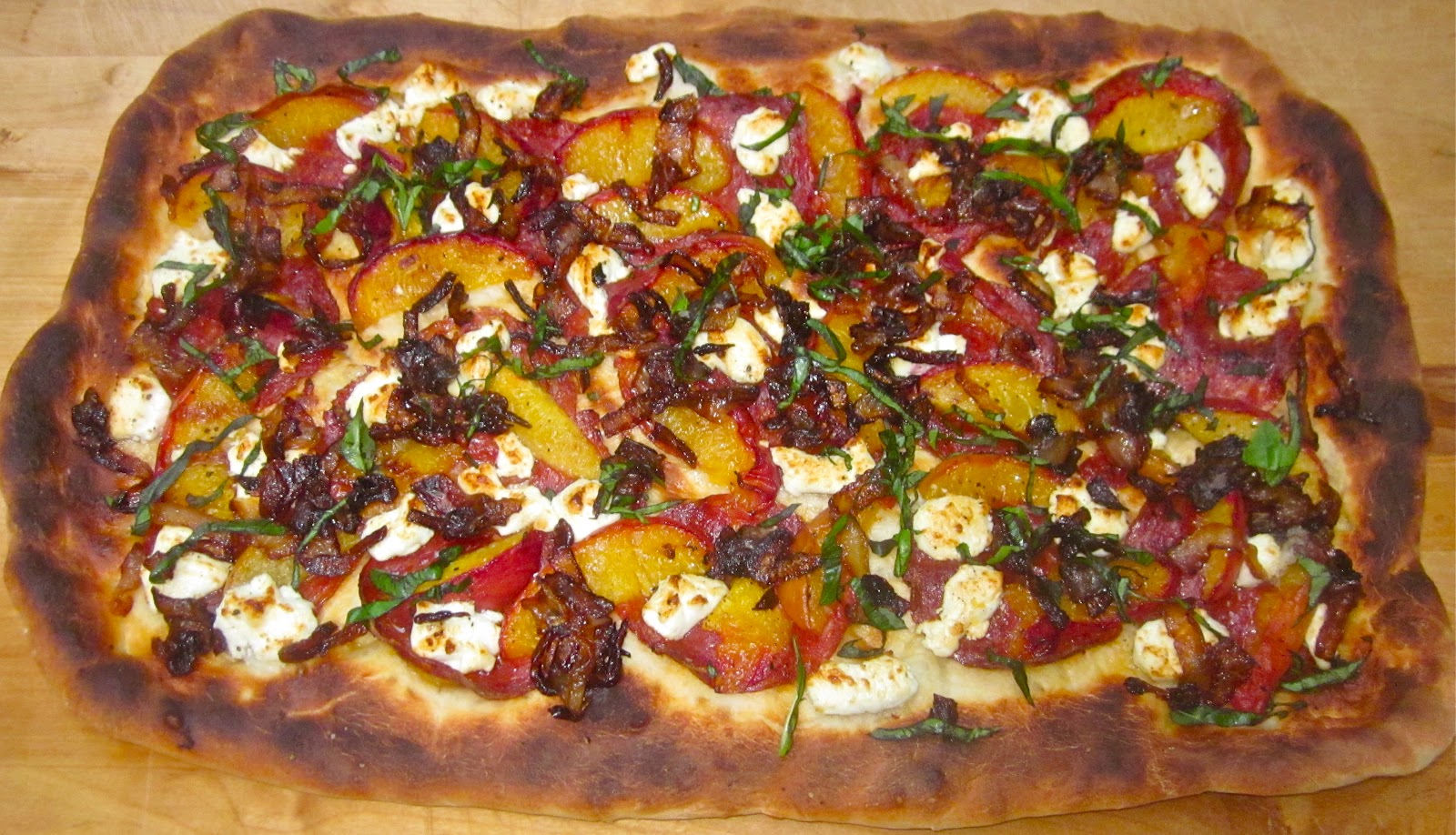 Spicy Chorizo Pizza with Caramelized Onions, Goat Cheese