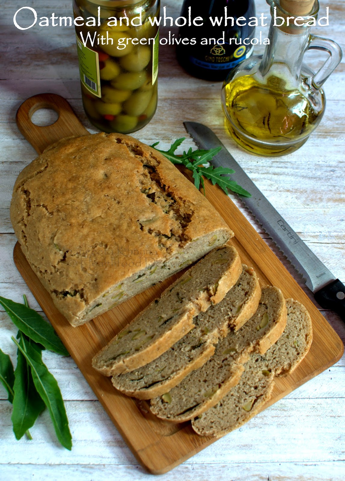 Baking breads oatmeal and whole wheat bread with green olives and rucola