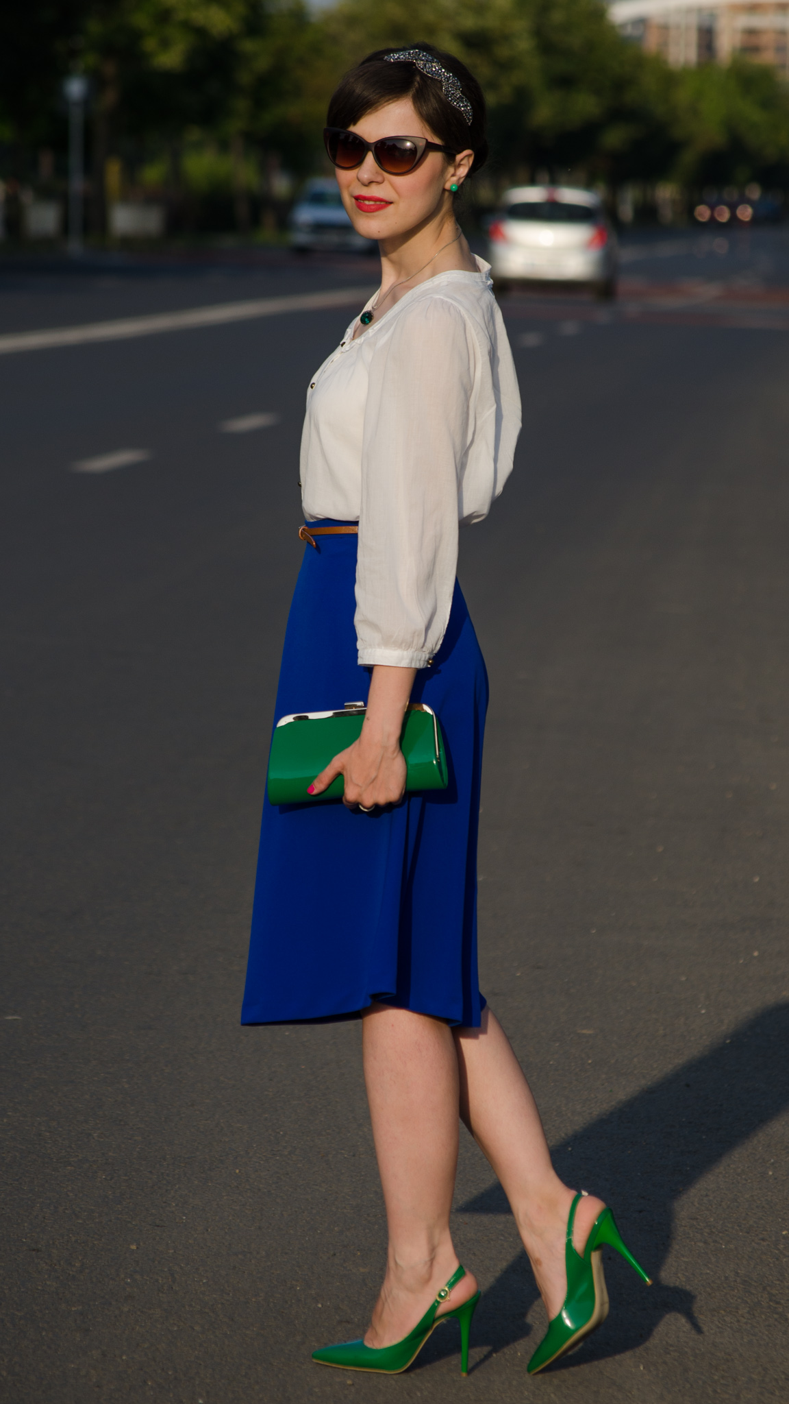 cobalt skirt white shirt emerald green heels emerald green clutch