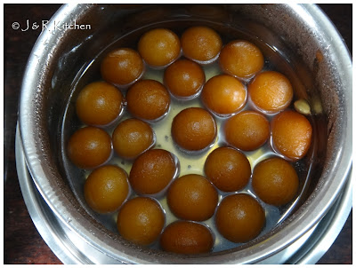 Gulab Jamuns soaking in the syrup