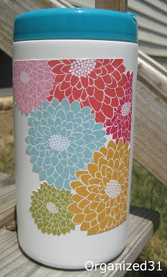 clorox wipes container decorated with flowered paper.