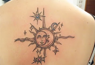 tattoo with the sun and the moon surrounded by stars