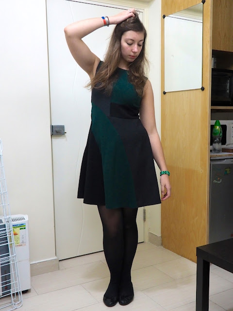 Emerald & Jade | outfit of green, black and grey geometric design smart dress, with black tights & flat shoes