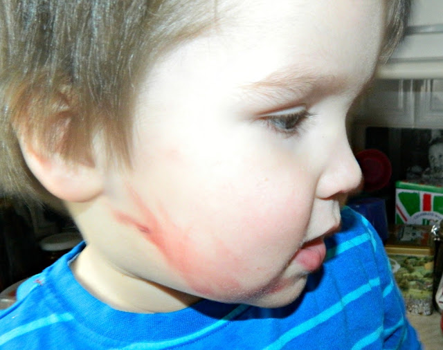 Little Boy toddler drawn face lipstick