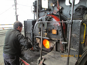 Stoking the historic steam railway engine.