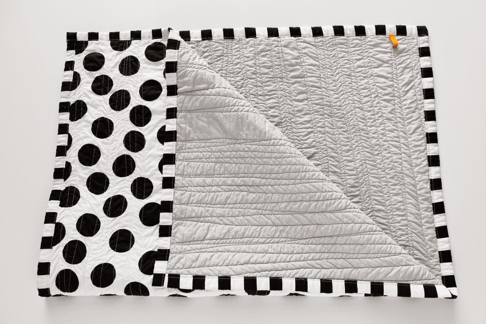 maker*land. Black and white baby quilt.