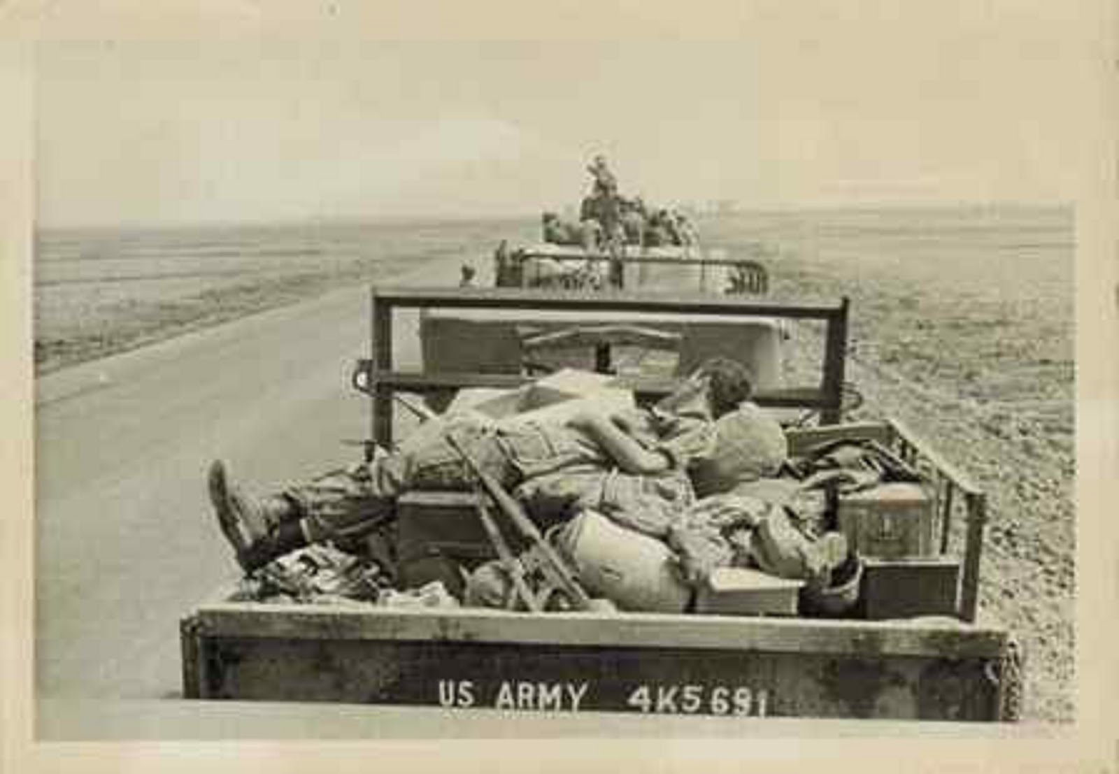 TRUCK LOAD OF DEAD BODIES FROM THE 199th LIGHT INFANTRY BRIGADE LEAVING THE BATTLEFIELD IN THE