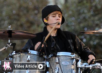 justin bieber as a baby playing drums. Bieber lip-syncs, but plays