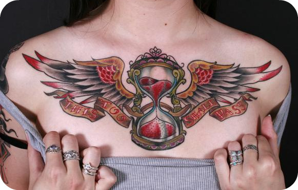 tattos on chest. Featured tattoo/location: winged hourglass on my chest with a banner saying 