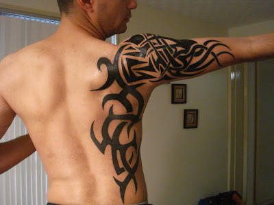 tattoos for guys ribs. Tribal Tattoos Gallery.