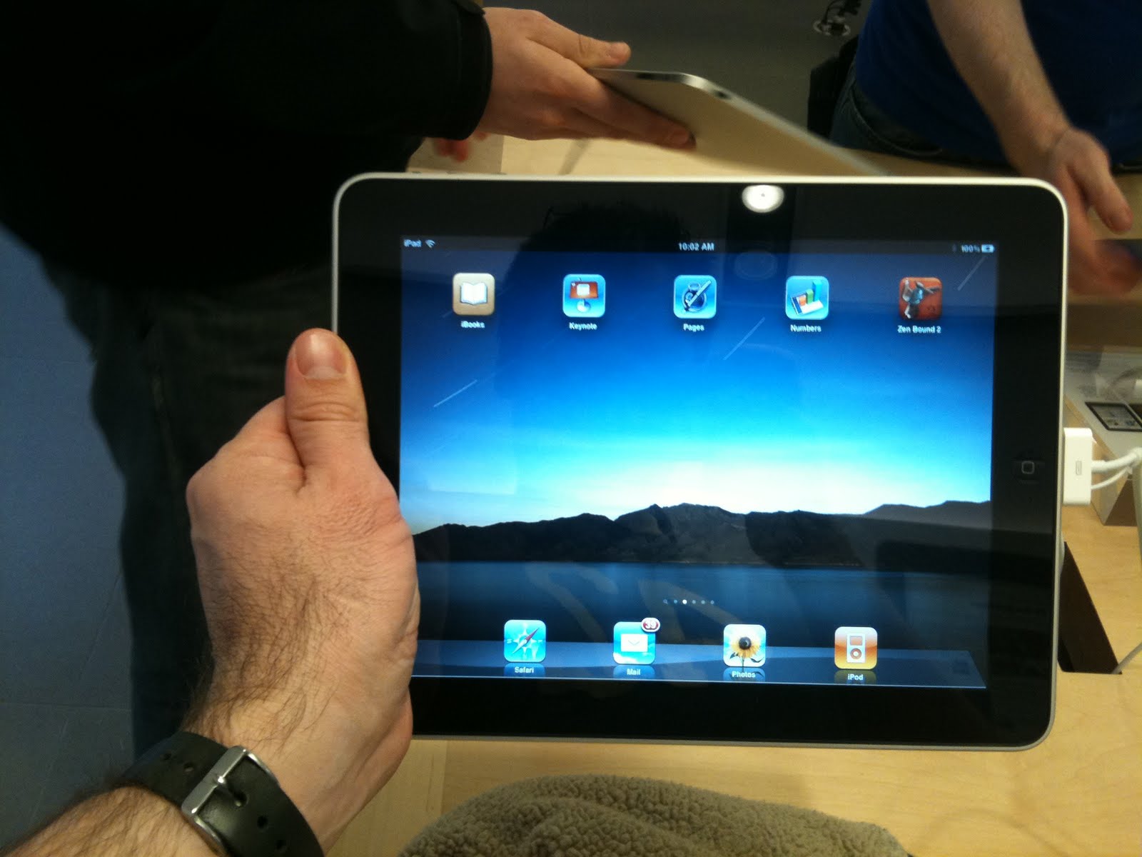 Hands Holding Ipad