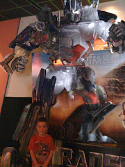 Cameron next to Optimus Prime