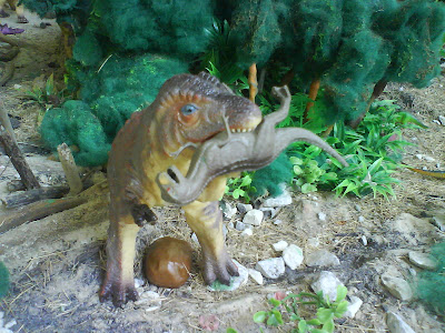 dinosaur eating dinosaur