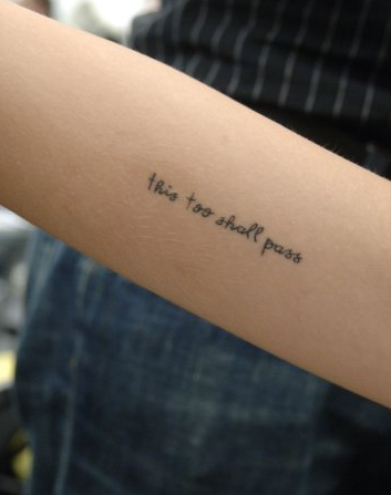 'This too shall pass' on her inside right upper arm