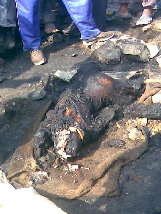 picture showing dead body of a person who was caught by fire