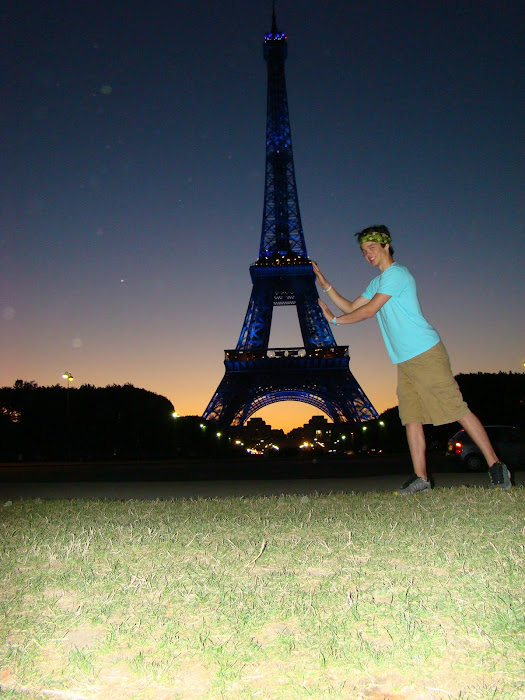 Sam leaning on Eiffel Tower